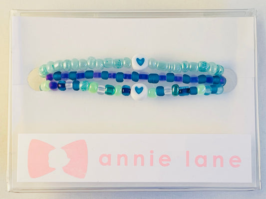 Turquoise/purple set of three bracelets